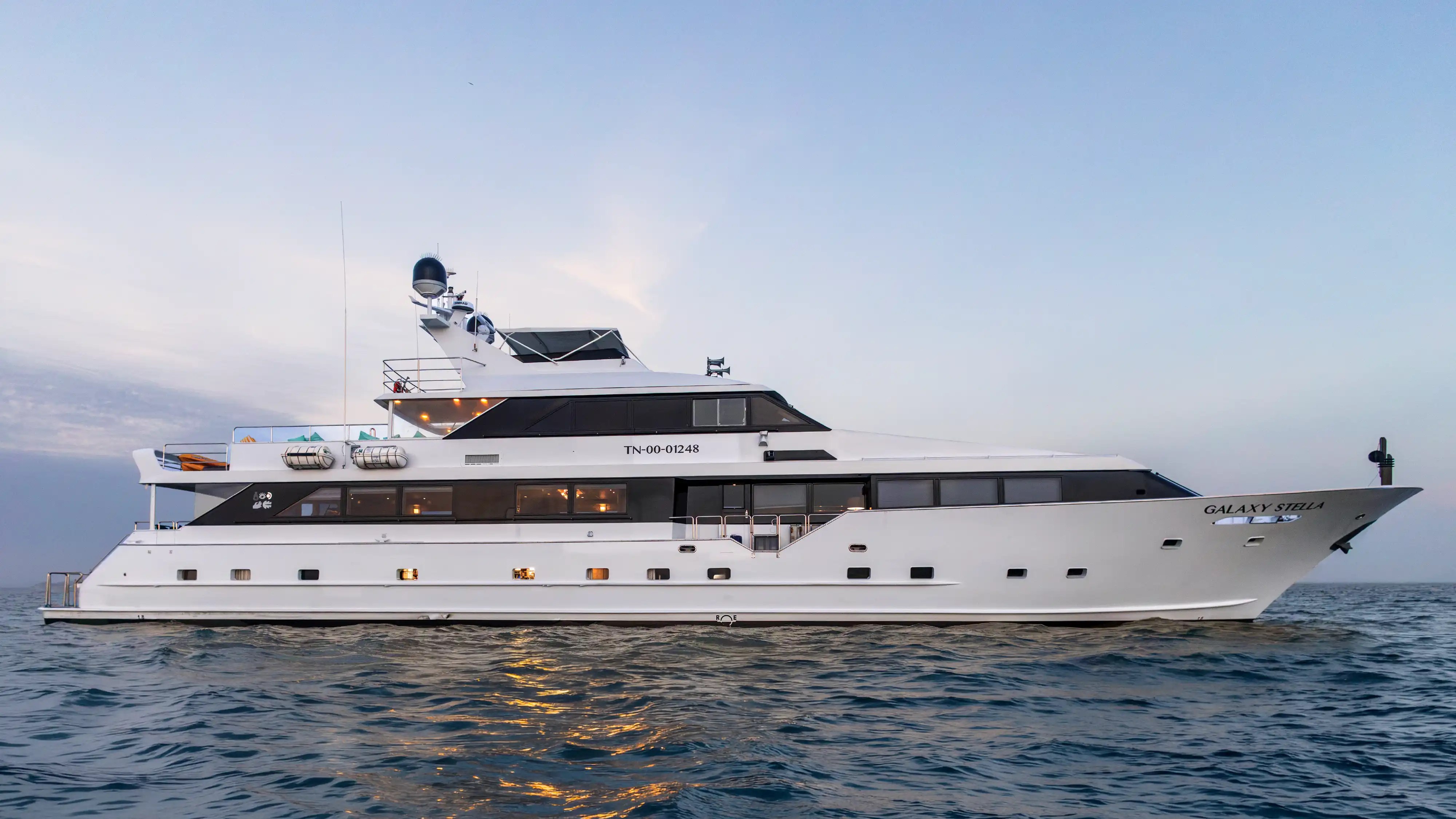 Galaxy Stella yacht navigating the Galapagos Islands during the late afternoon